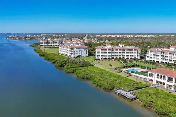 a view of a swimming pool with a patio and garden