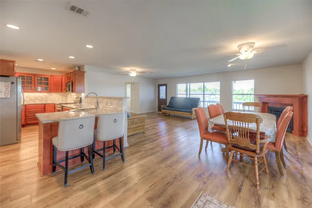 a view of a dining room with furniture and wooden floor