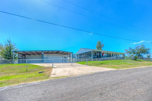 a view of swimming pool is middle in the backyard of house