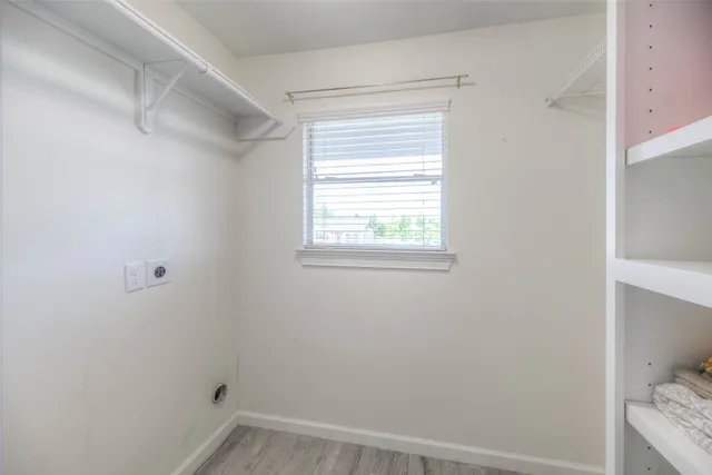 a view of a room that has a window in it