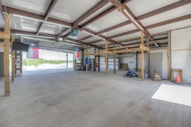 a view of empty room with wooden ceiling