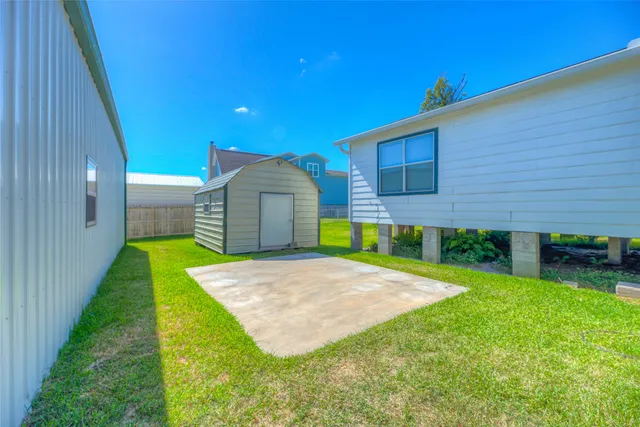 a view of a backyard of a house