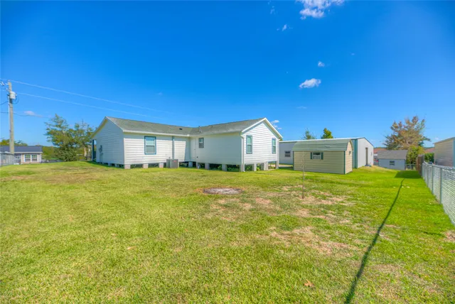 a front view of house with garage and yard