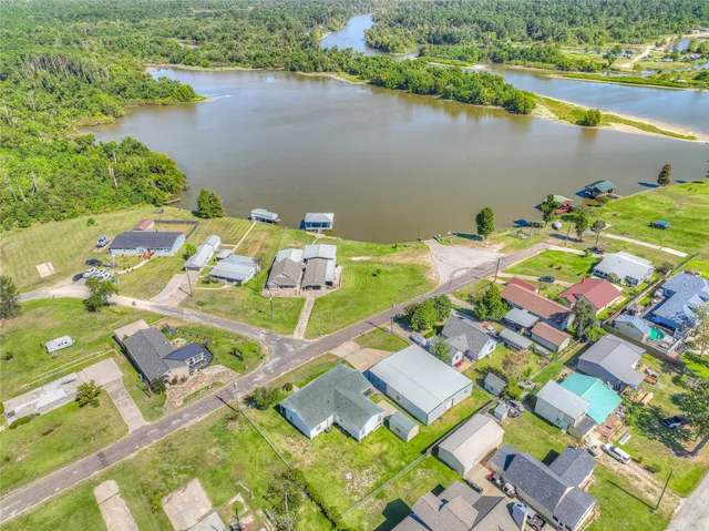 an aerial view of a house a lake view