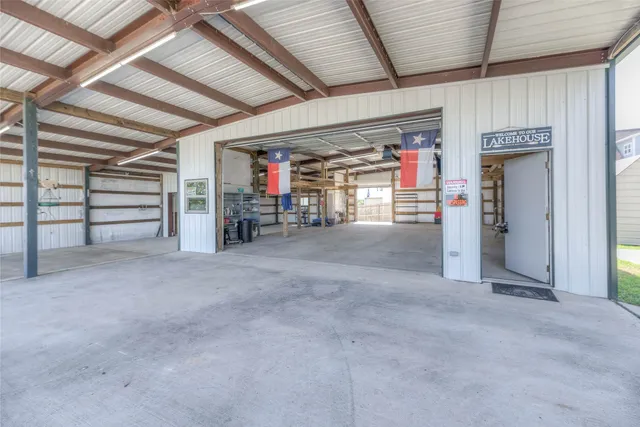 a view of empty room with wooden ceiling