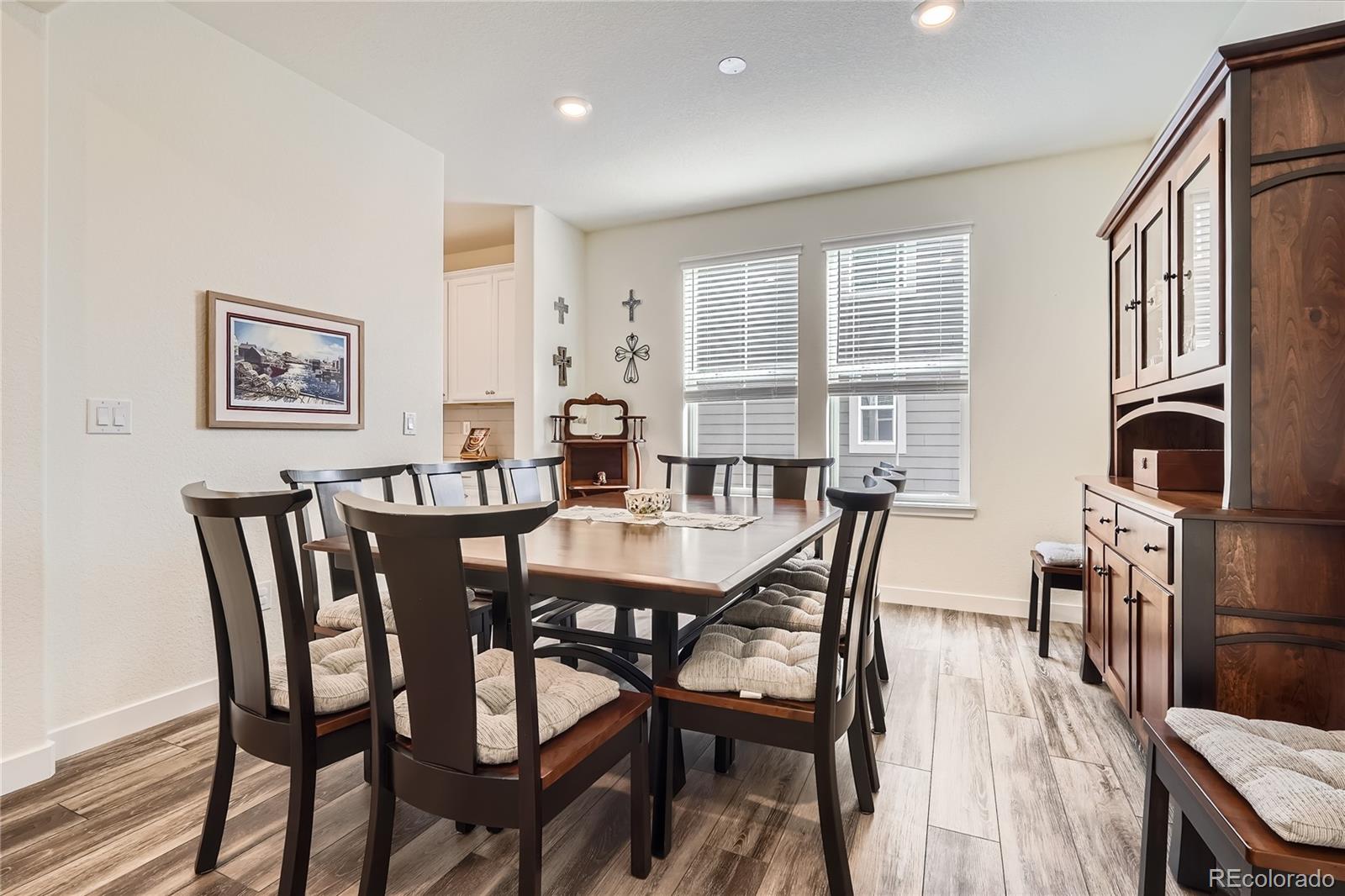 946 Compass Drive Erie, CO 80516 - Photo 11 of 28 a view of a dining room with furniture window and wooden floor
