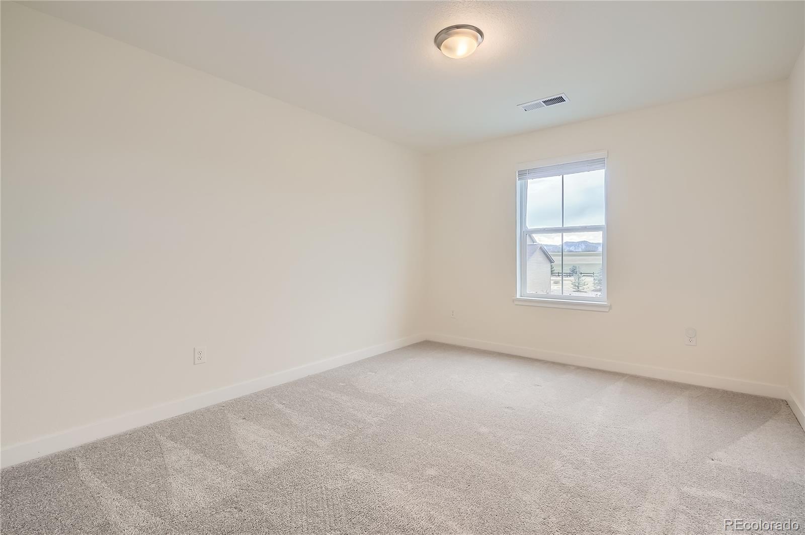 946 Compass Drive Erie, CO 80516 - Photo 21 of 28 an empty room with a window