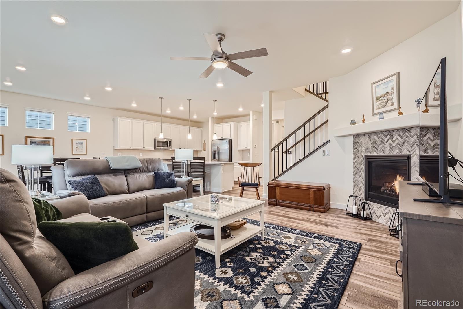 946 Compass Drive Erie, CO 80516 - Photo 9 of 28 a living room with furniture and a fireplace