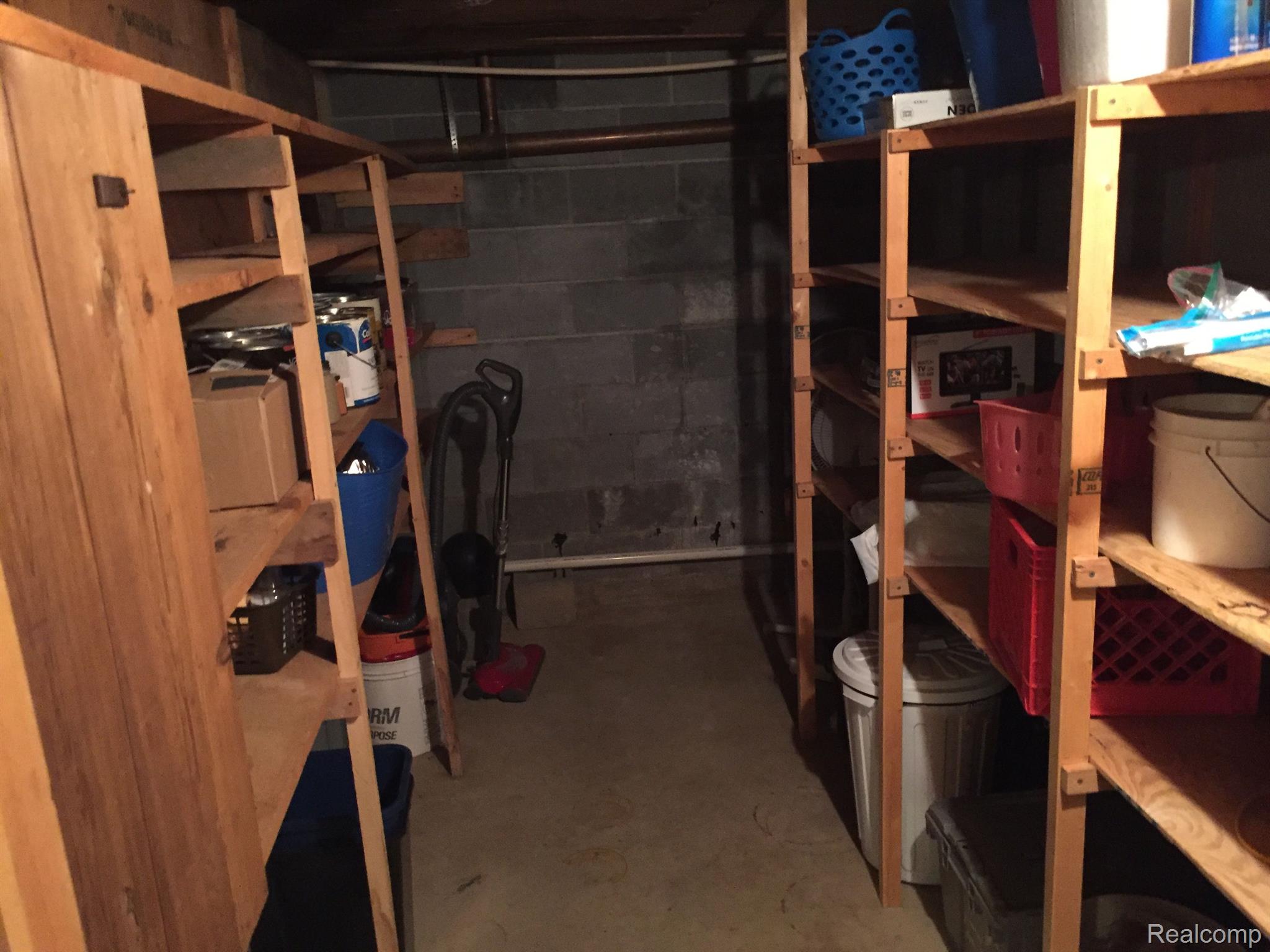 5657 Cribbins Road Avoca, MI 48006 - Photo 42 of 66 Storage room with storage shelves in basement