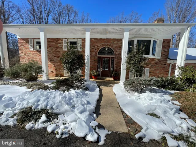 a view of a house with a pathway and a yard
