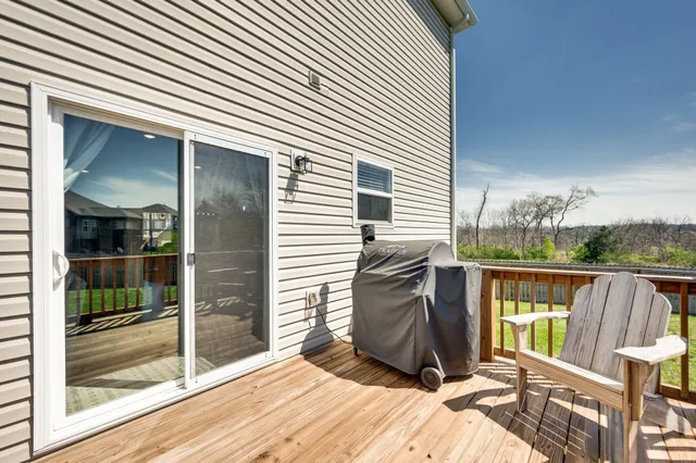 a view of a two chairs in the balcony