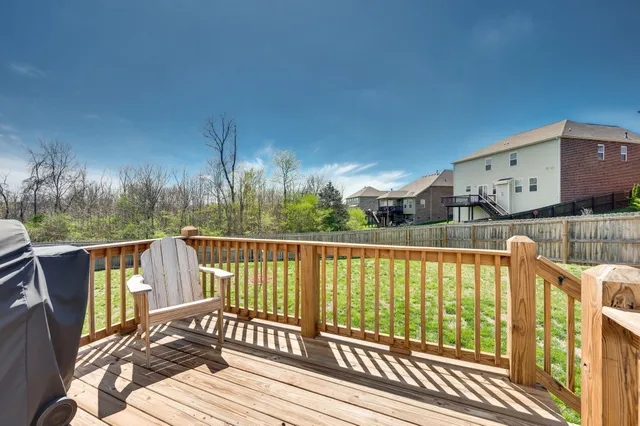 a view of a balcony with wooden floor