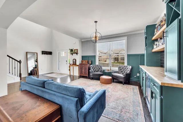 a living room with furniture fireplace and a flat screen tv
