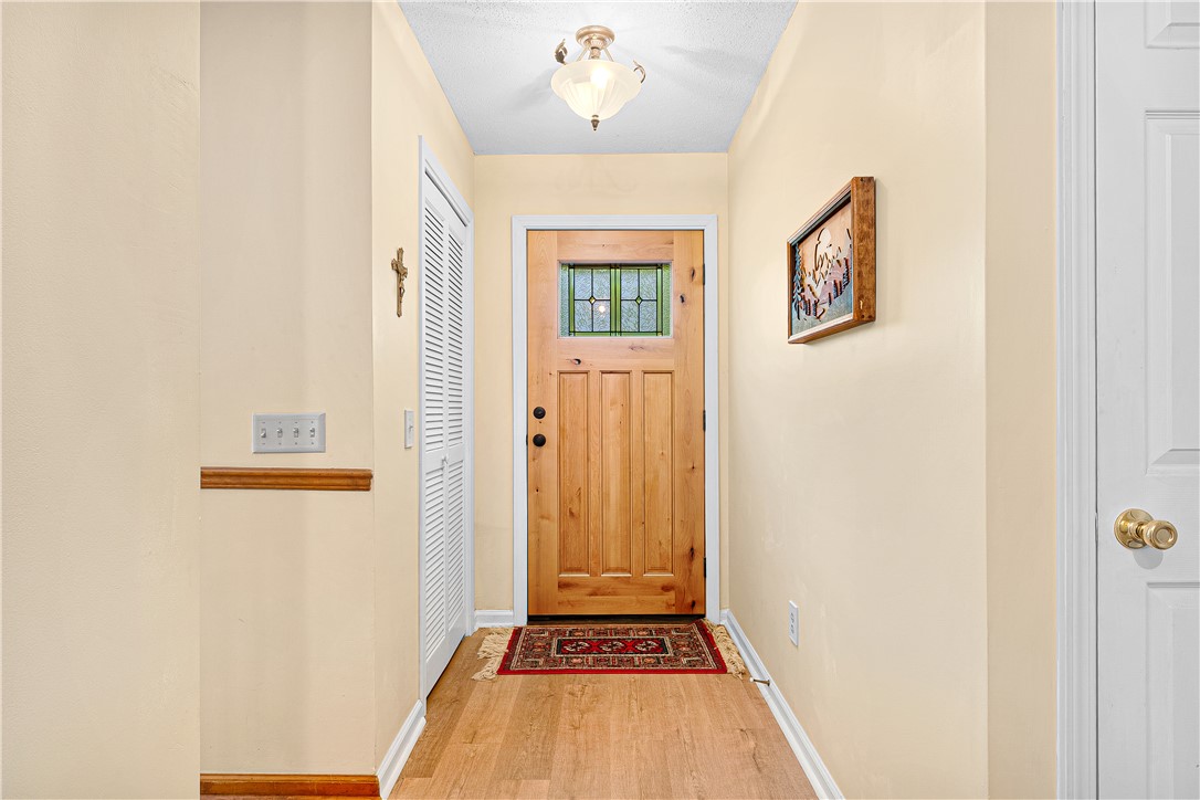 139 Tulip Lane Westminster, SC 29693 - Photo 24 of 37 A welcoming wooden front door with leaded glass detail opens to rich hardwood flooring.