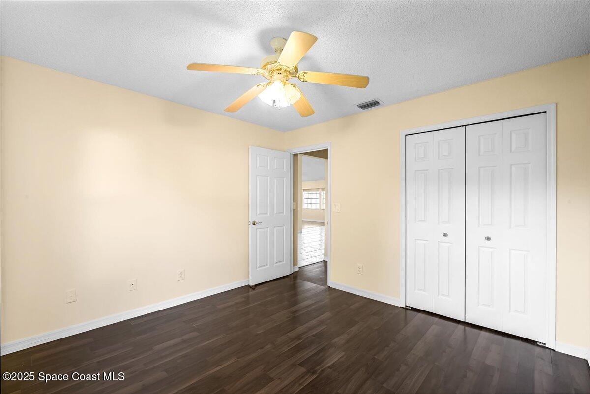 295 Oak Lake Road Melbourne, FL 32901 - Photo 17 of 40 wooden floor in an empty room