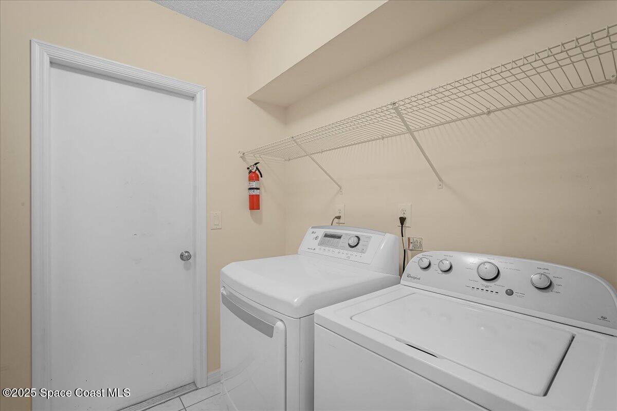 295 Oak Lake Road Melbourne, FL 32901 - Photo 22 of 40 a utility room with dryer and washer