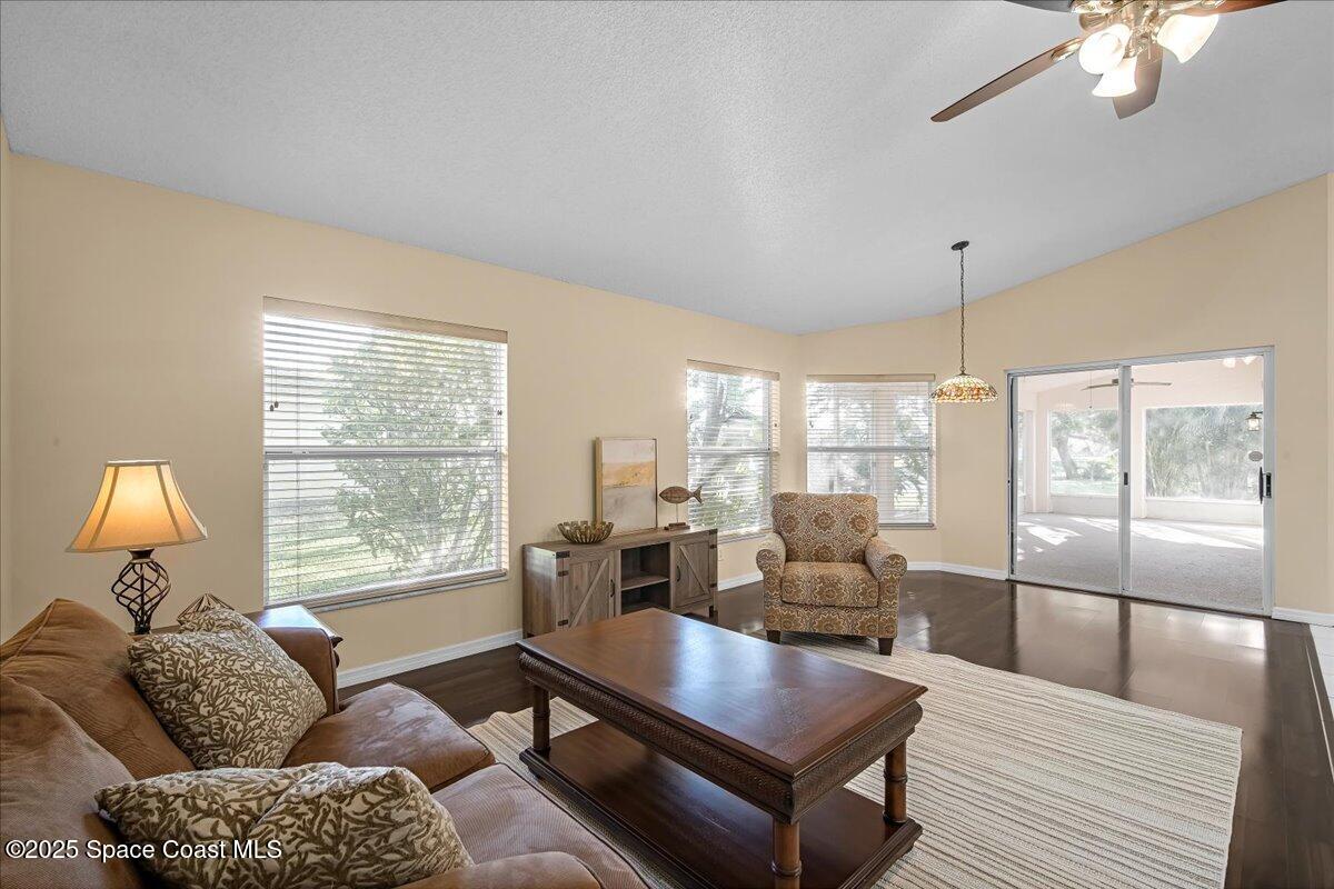 295 Oak Lake Road Melbourne, FL 32901 - Photo 6 of 40 a living room with furniture and a large window