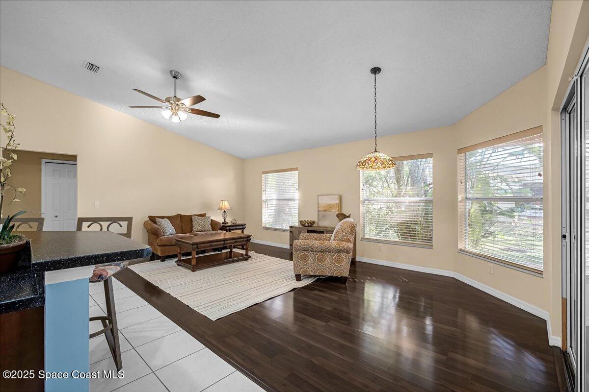 295 Oak Lake Road Melbourne, FL 32901 - Photo 9 of 40 a living room with furniture large window and wooden floor