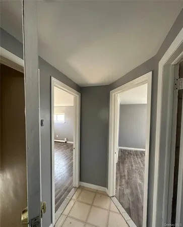 an empty room with mirror