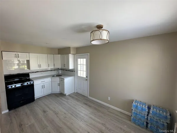 a kitchen with a refrigerator and dishwasher a stove top oven