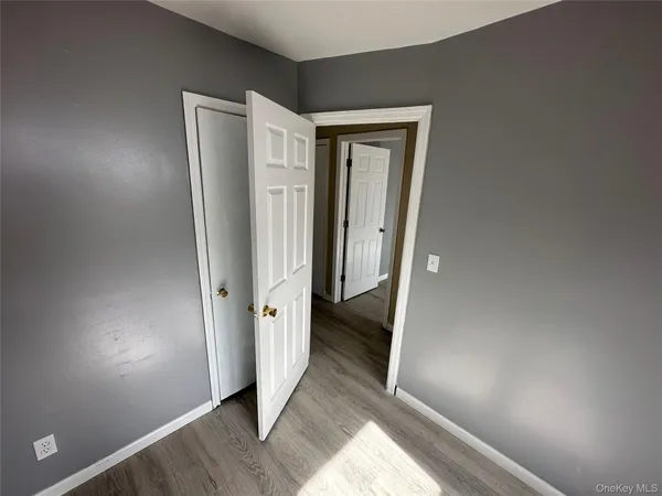 a view of a bathroom with wooden floor