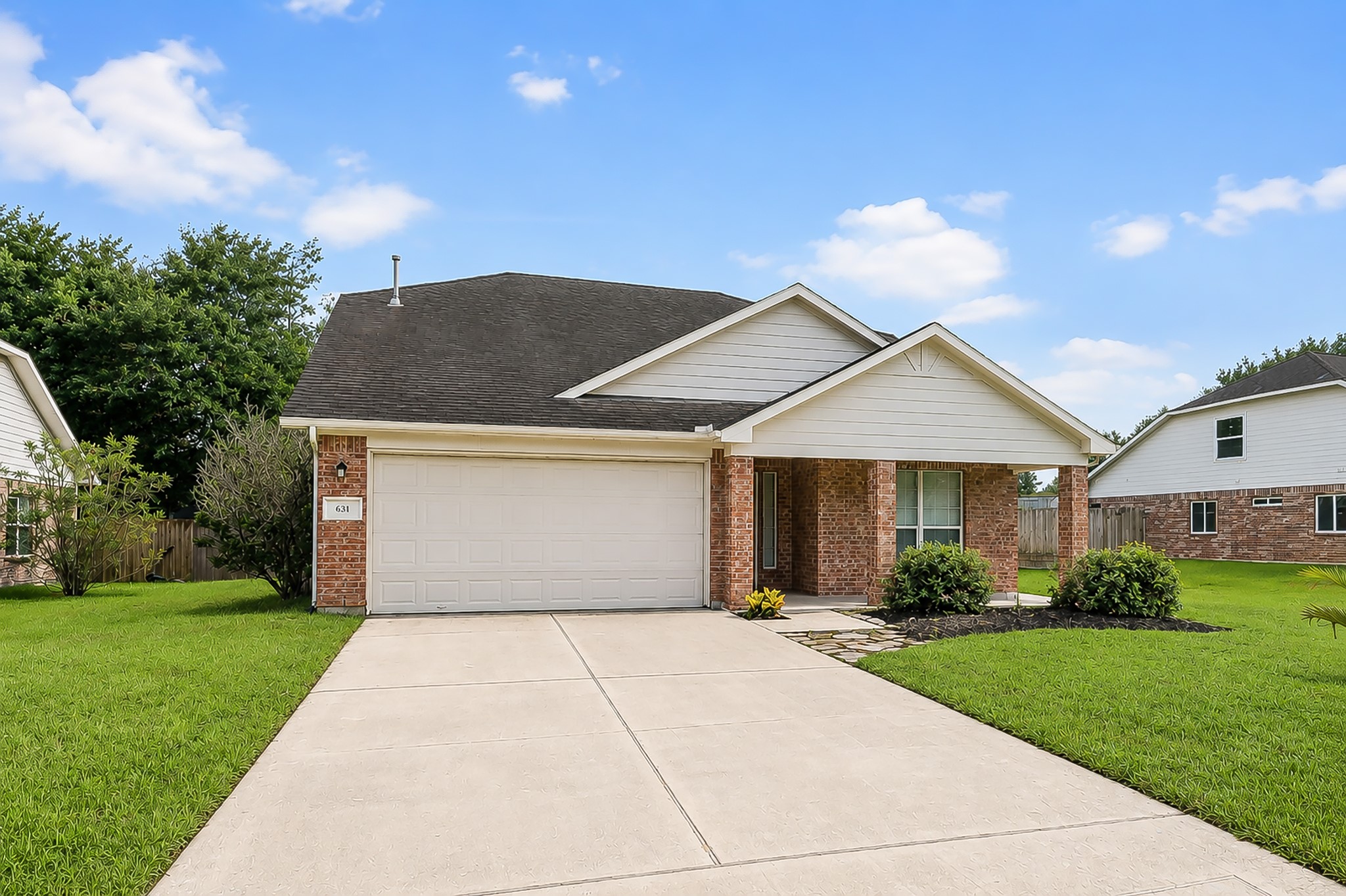 631 Timberstand Lane Spring, TX 77373 - Photo 2 of 38 Beautiful curb appeal with a classic brick exterior, inviting entry, and a well-maintained design ready to welcome you home.