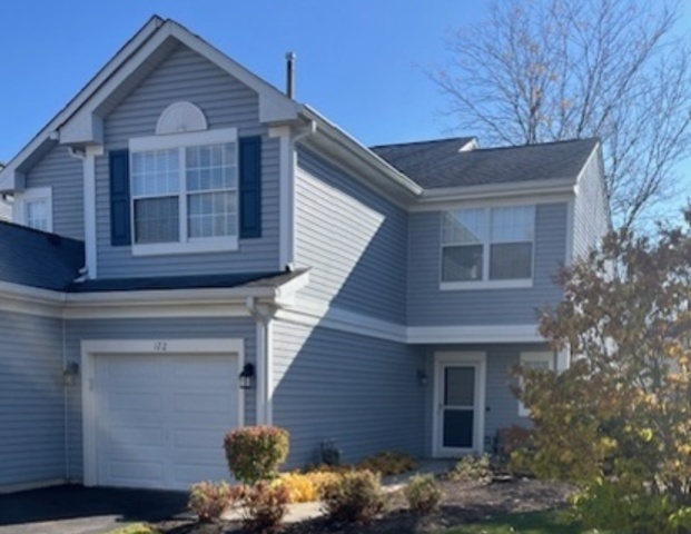 122 Polaris Drive Lake In The Hills, IL 60156 - Photo 1 of 23 a front view of a house with a yard