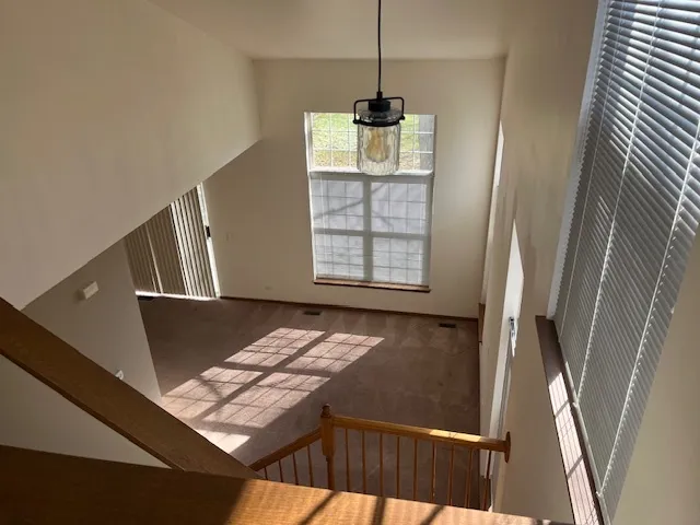 a view of wooden floor and chair in a room