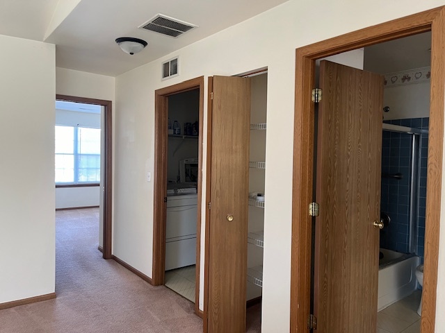 122 Polaris Drive Lake In The Hills, IL 60156 - Photo 15 of 23 a view of a hallway with closet and a bathroom
