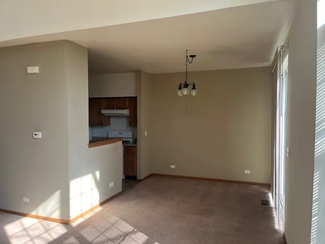 a view of a hallway with a bathroom