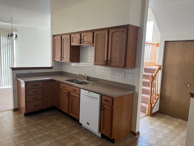 122 Polaris Drive Lake In The Hills, IL 60156 - Photo 9 of 23 a kitchen with stainless steel appliances granite countertop a sink and a stove top oven