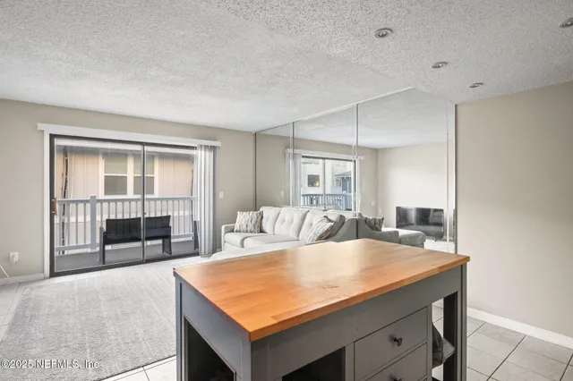 a room with a bed and a large window