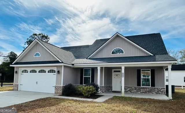 a view of a house with a yard