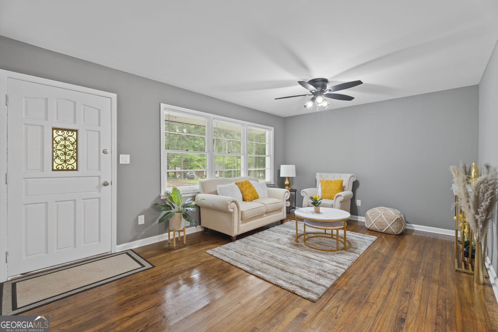 3567 Forrest Park Road Southeast Atlanta, GA 30354 - Photo 7 of 29 a living room with furniture and wooden floor