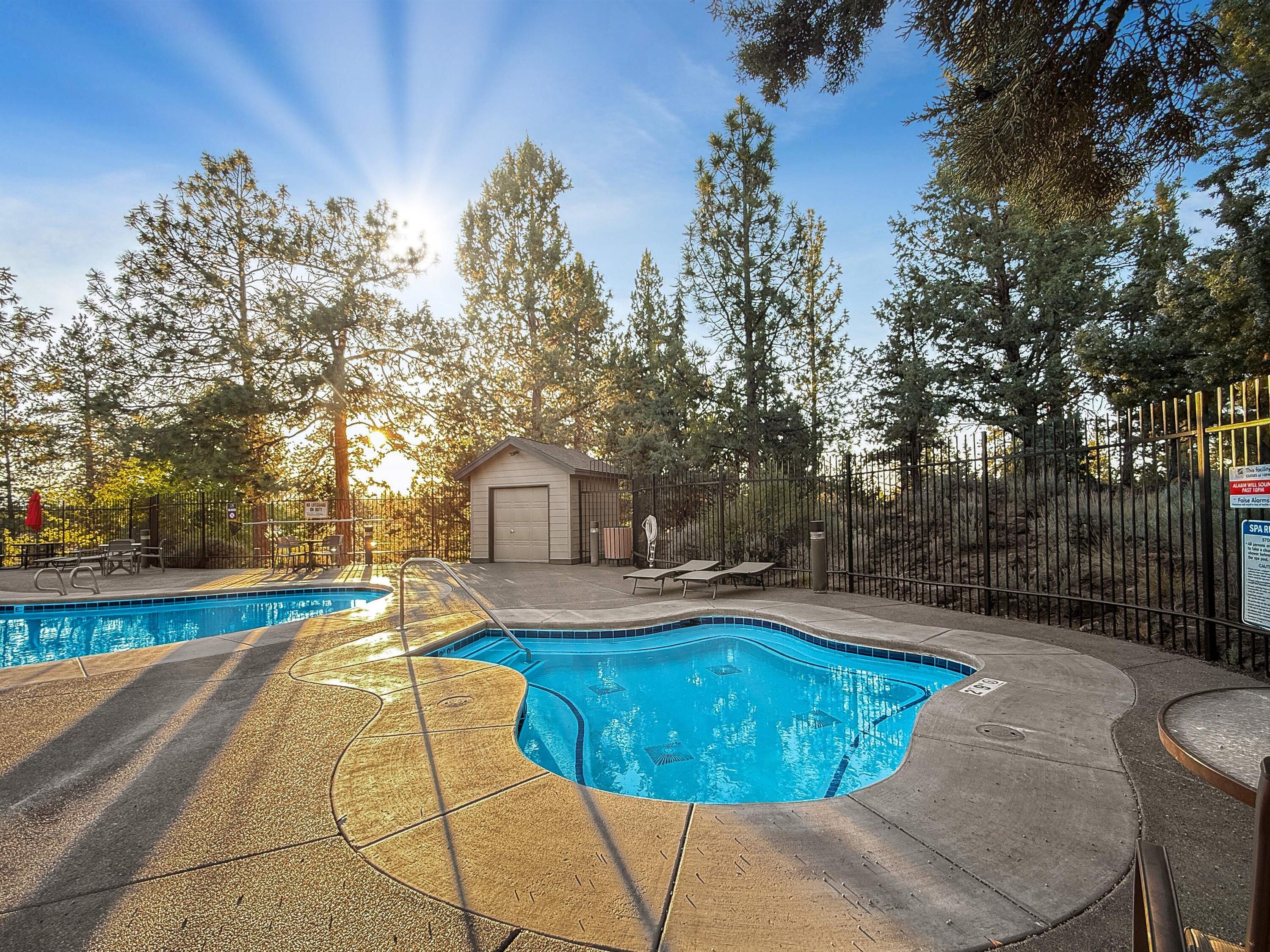 61072 Manhae Loop Bend, OR 97702 - Photo 49 of 63 a view of a swimming pool with a patio