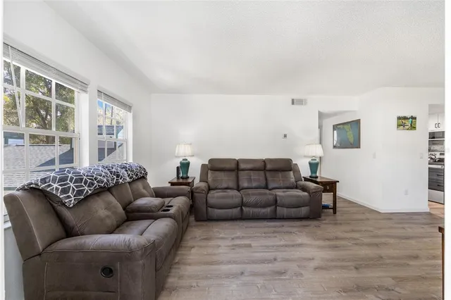 a living room with furniture and a window