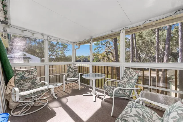 a view of a living room and a balcony