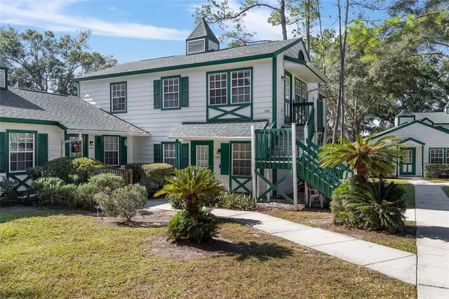 a front view of house with yard and outdoor seating