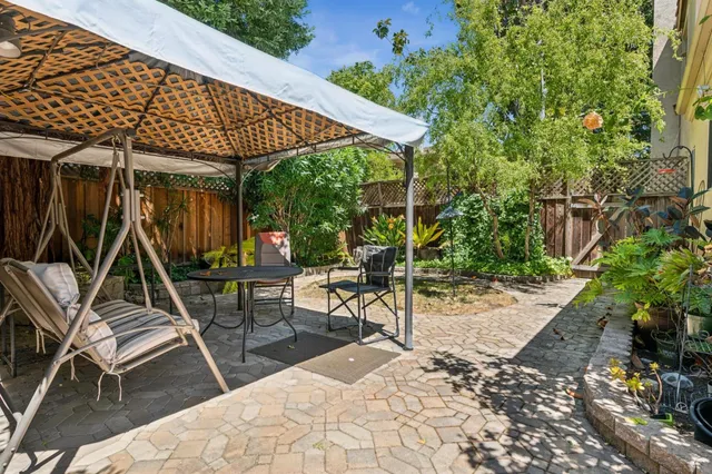 an aerial view of a houses with a yard