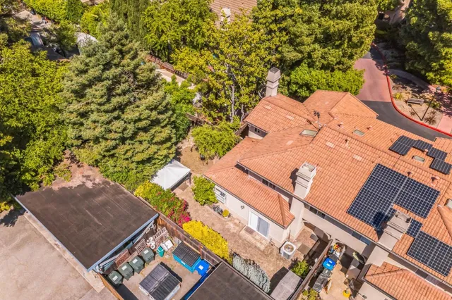 a view of kitchen with wooden floor and electronic appliances