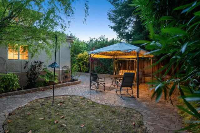 a view of a hallway with wooden floor and closet