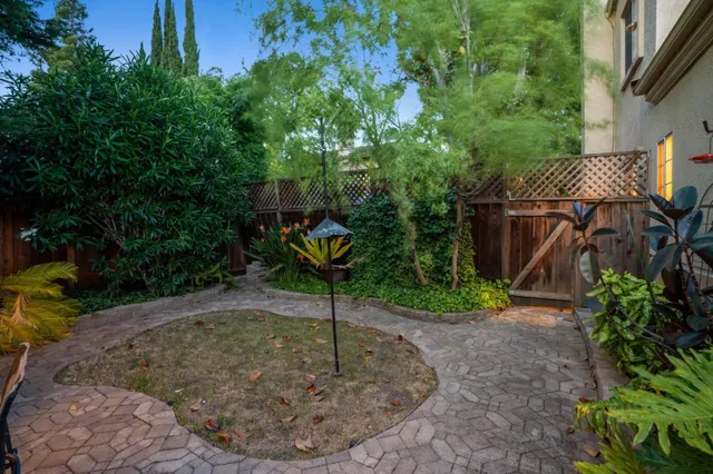 a kitchen with a stove a sink and a microwave