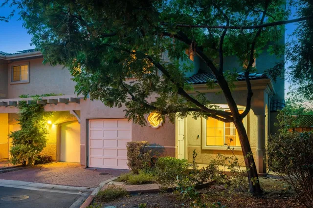 an aerial view of a house with a yard basket ball court and outdoor seating