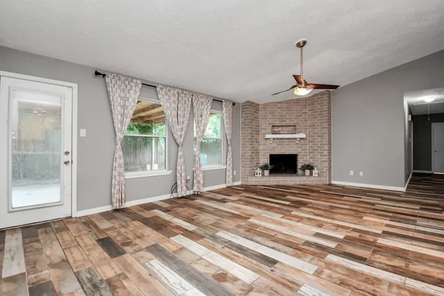 a bedroom with a bed and a fireplace