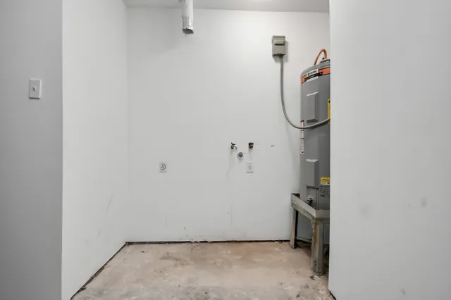 a view of a storage & utility room with a door