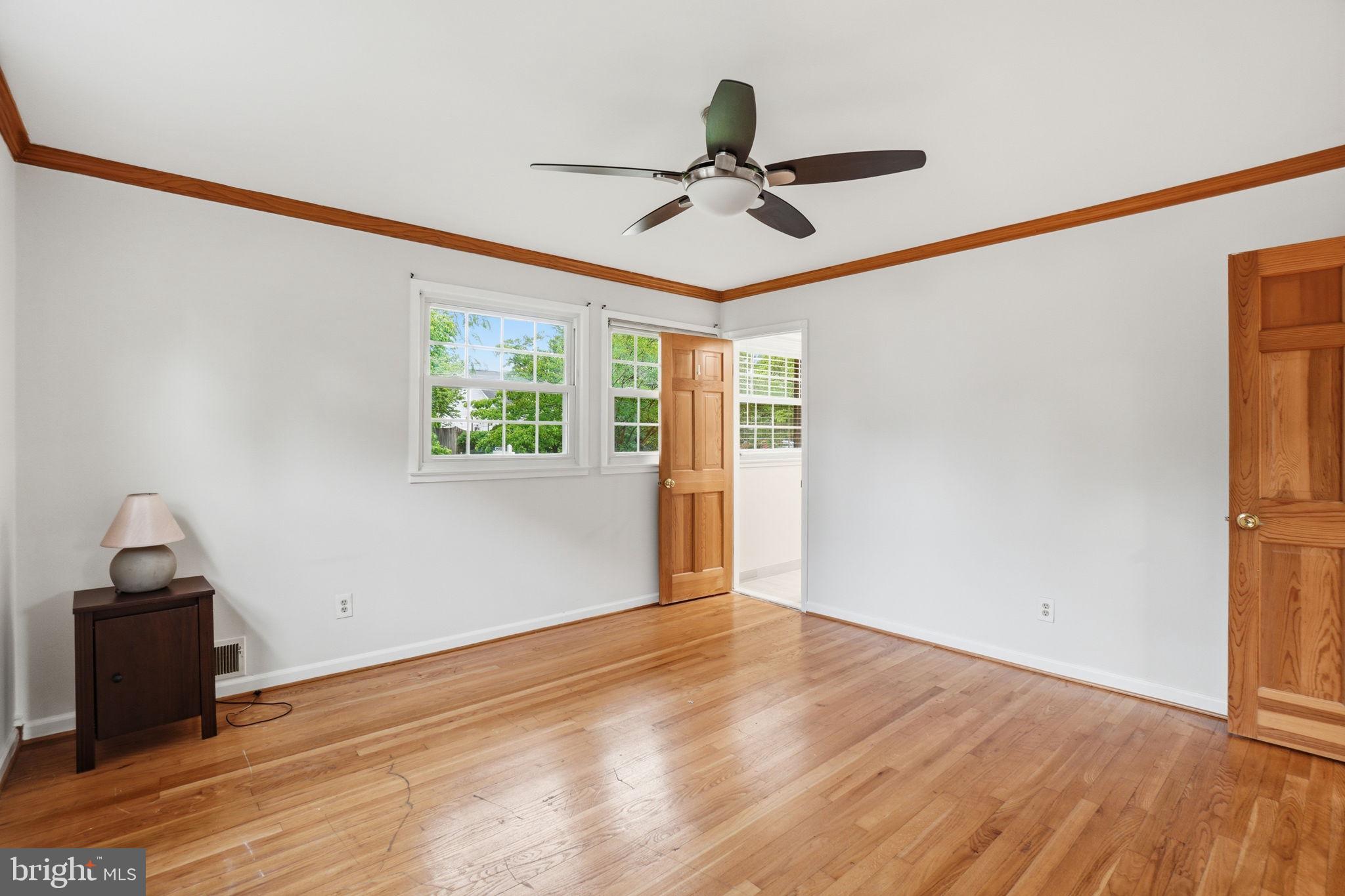 5304 Pillow Lane Springfield, VA 22151 - Photo 17 of 32 a view of empty room with wooden floor and ceiling fan