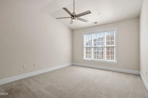 a picture of a park with a white wall