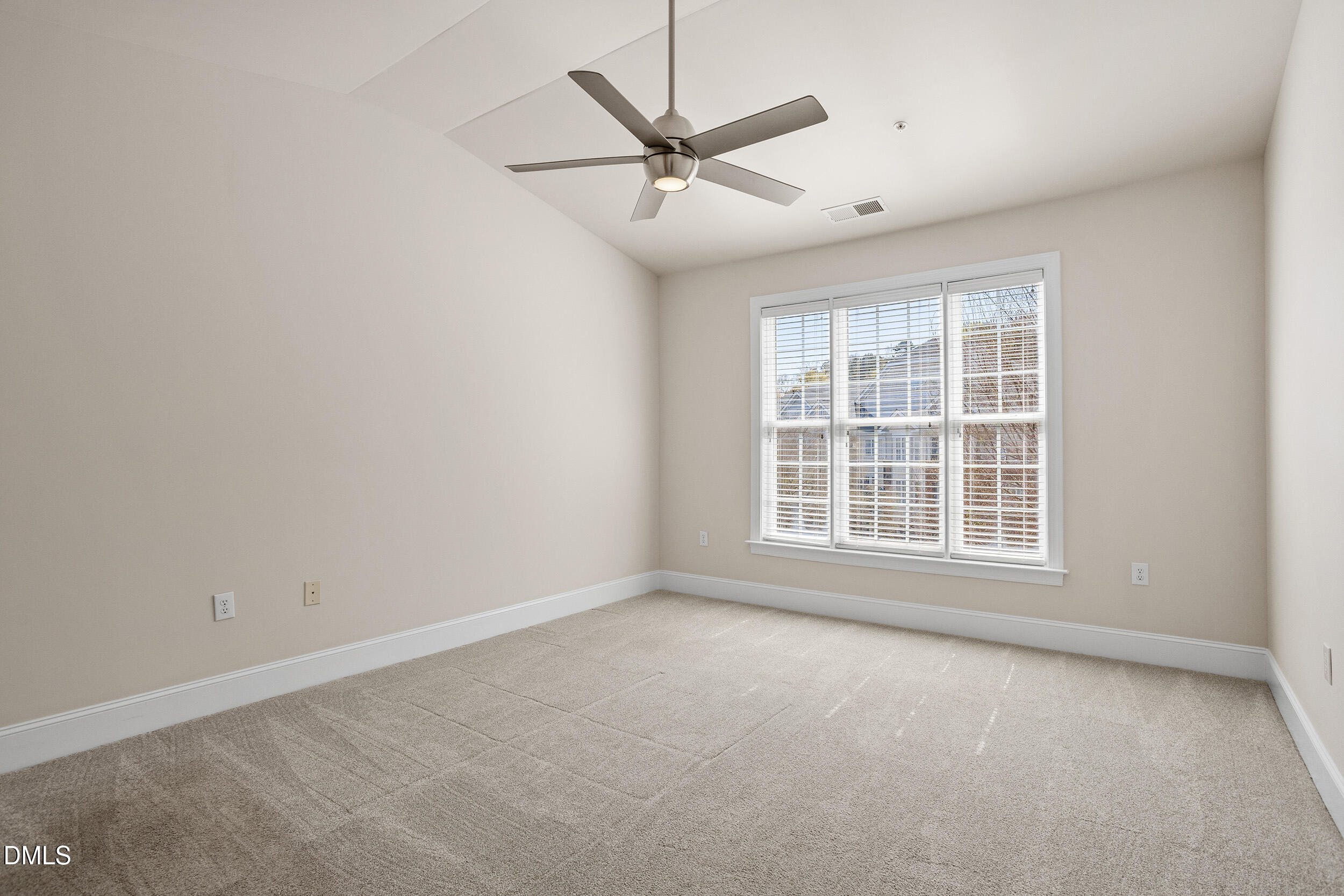 3700 Baron Cooper Pass, Unit 204 Raleigh, NC 27612 - Photo 30 of 45 an empty room with a window and a ceiling fan