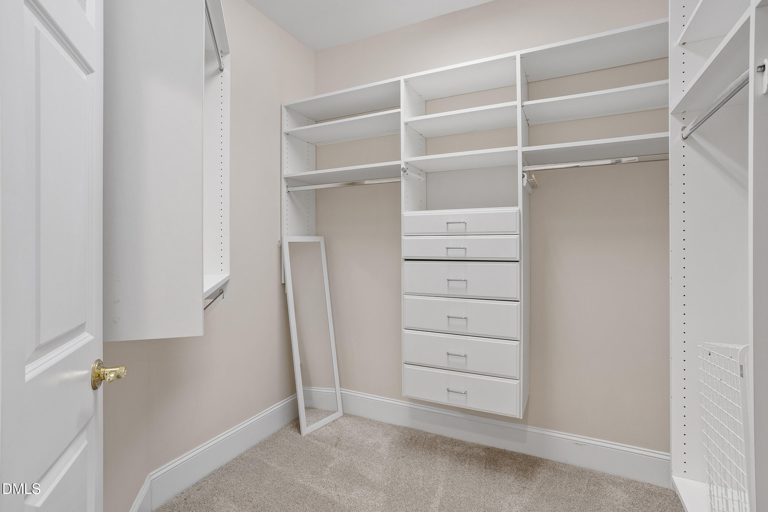 3700 Baron Cooper Pass, Unit 204 Raleigh, NC 27612 - Photo 31 of 45 a view of walk in closet with empty racks