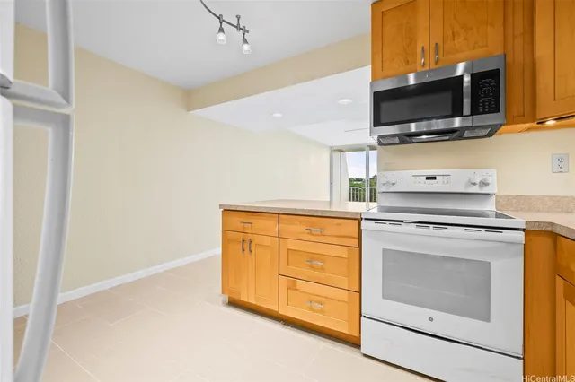 a kitchen with a stove and a microwave